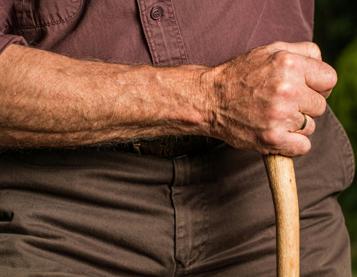 Person holding a cane.