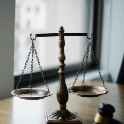 The scales of justice alongside a Judge's gavel