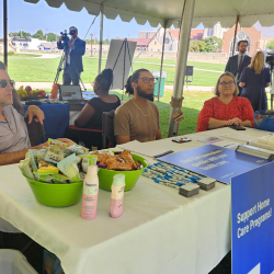 From left to right: MEJI staff Matt Nagaj, Yosué González, and Rachel Richards tabling at the March for Medicaid.